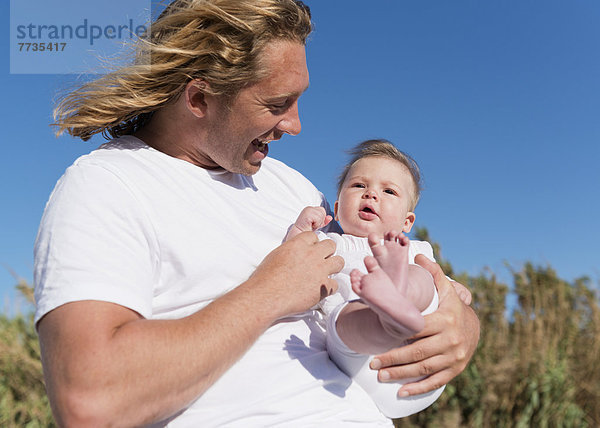 A Father Holding His Infant  Tarifa Cadiz Andalusia Spain