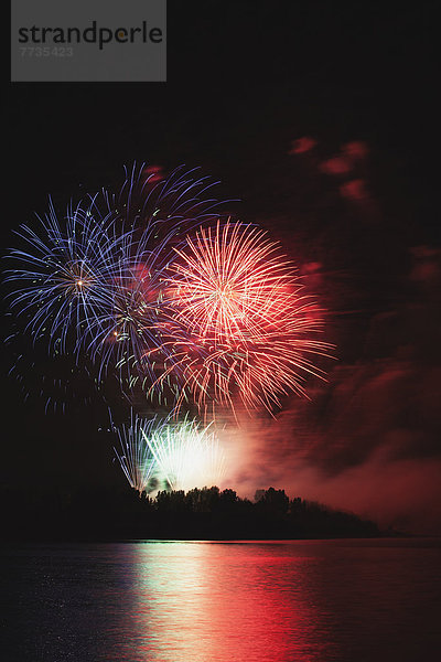 Fireworks Displays Reflecting Off Water  Calgary Alberta Canada