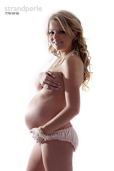 Schwangere Frau mit Hand auf dem Bauch