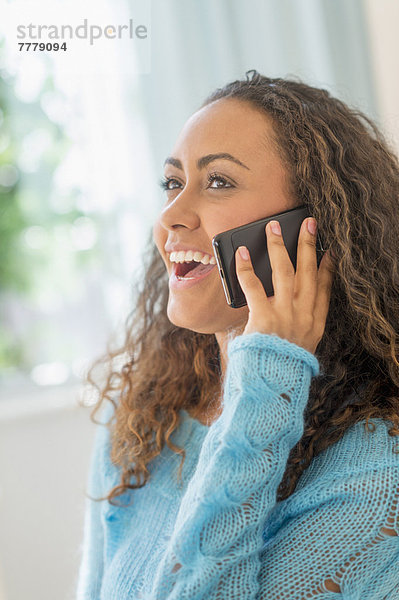 Young woman talking on phone