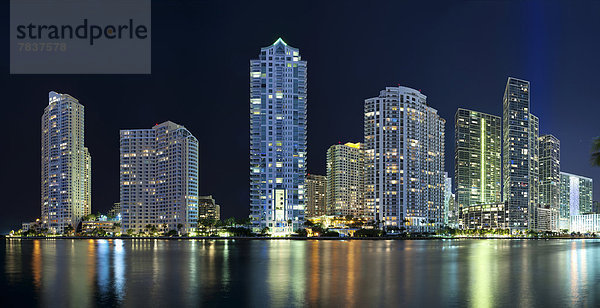 Skyline at night  with Three Tequesta Point  One Tequesta Point  Asia Condominium  Carbonell Condominium  Icon Brickell South Tower  Icon Brickell North Tower  Viceroy  Rivergate Plaza and 550 Bric  from left to right