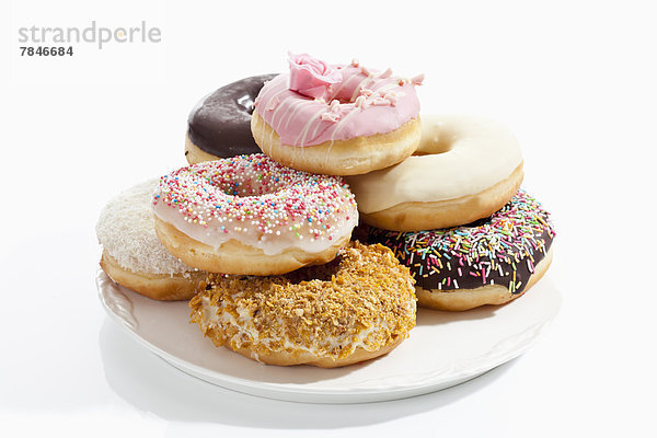 Variety of doughnuts on plate  close up