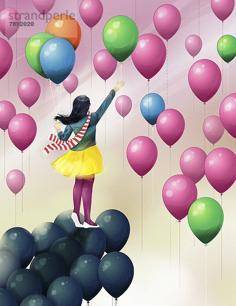 Mädchen auf schwarzen Luftballons greift nach bunten Luftballons am Himmel