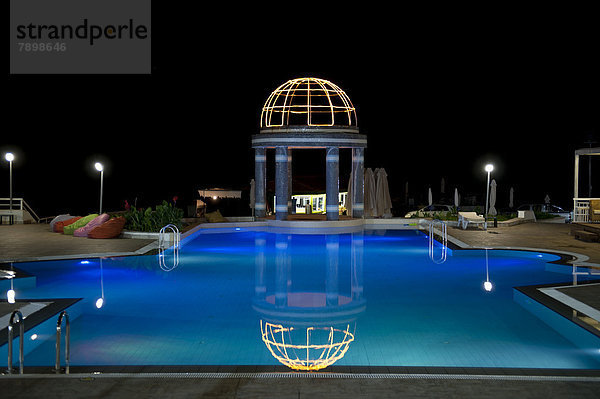 Blue pool at night  The Dome Hotel
