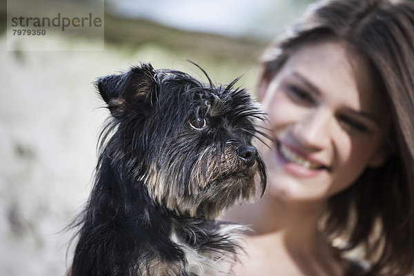 Portrait of woman with her dog  smiling
