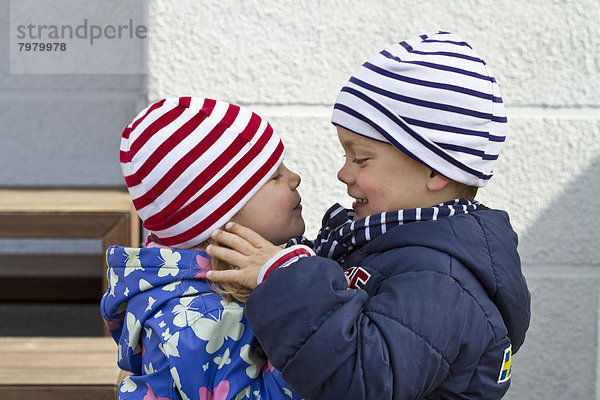 Girl and boy looking at each other  close up