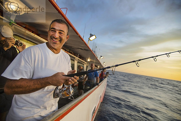 Man fishing while being photographed Corpus christi texas usa