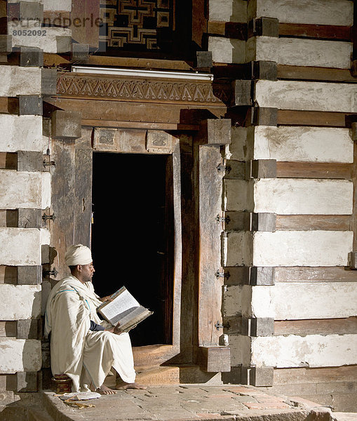 Ethiopian Orthodox priest reading bible  Lalibela  Northen Ethiopia