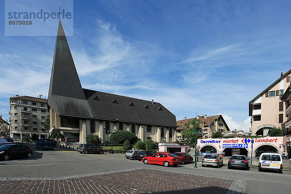 Town centre of Saint-Julien-en-Genevois  Church Square and shops.