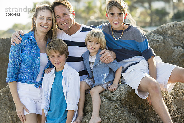 Family smiling together outdoors