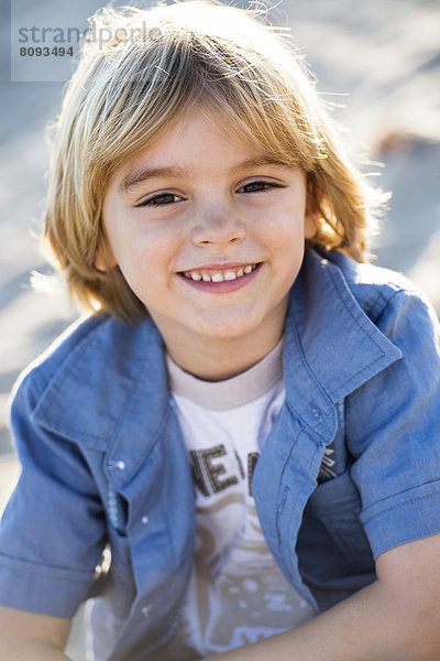 Hispanic boy smiling outdoors