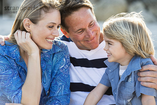 Family smiling together outdoors