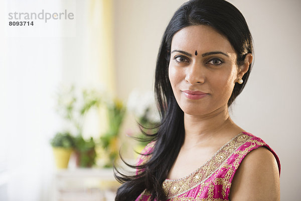 Indian woman wearing bindi and traditional garb