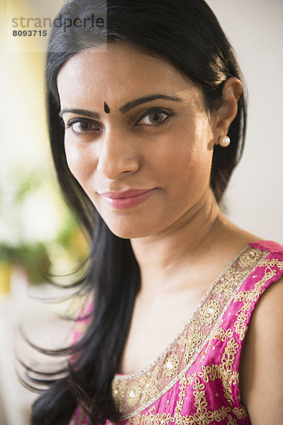 Indian woman wearing bindi and traditional garb