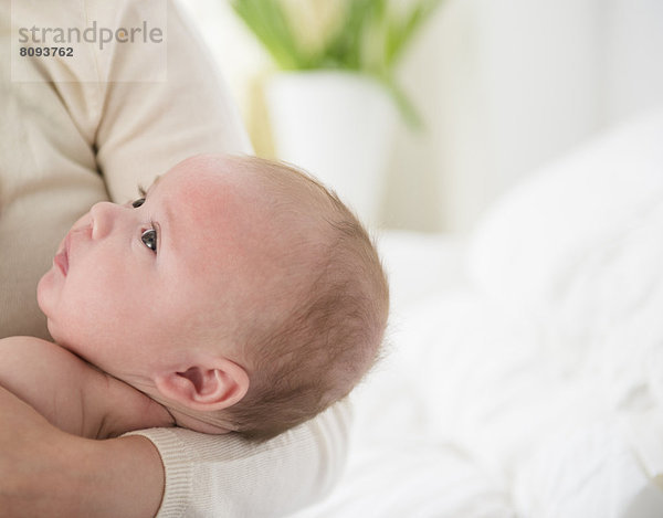 Caucasian mother holding baby