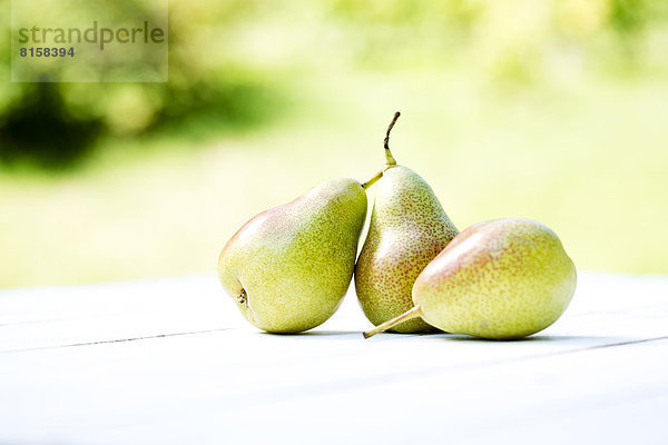 Pears on wooden table  close up