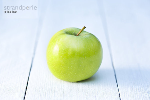 Green apple on table  close up
