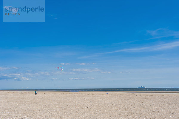 Denmark  Romo  Boy flying kite at North Sea