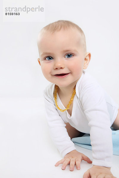 Portrait of baby boy crawling  smiling