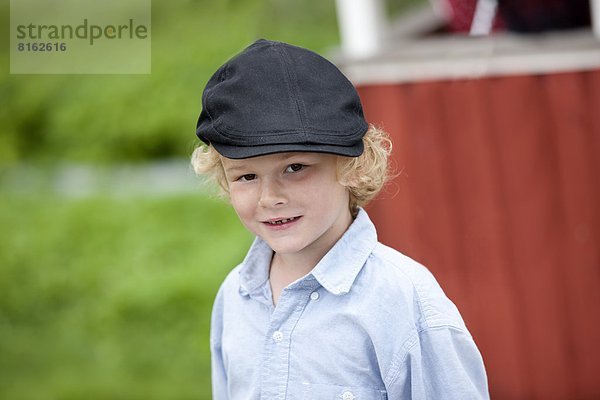 Portrait  Junge - Person  Mütze  Kleidung