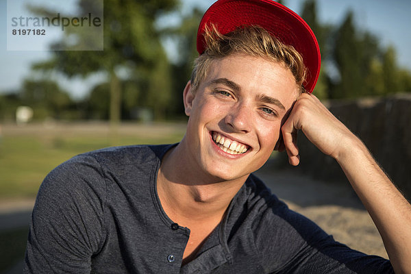 Germany  Young man in park  smiling