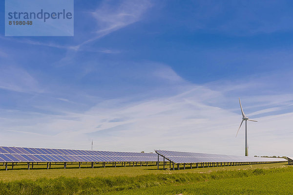 Germany  Schleswig-Holstein  View of solar panel and wind turbine in field