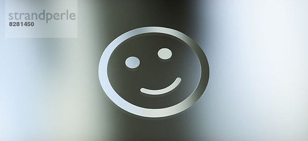 Grafik einer Smiley-Fläche vor grauem Gradientenhintergrund