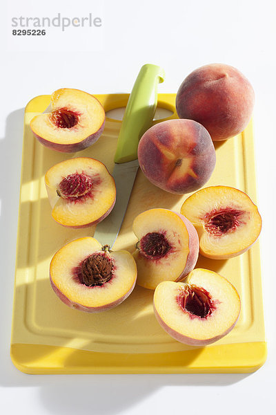 Peaches on cutting board