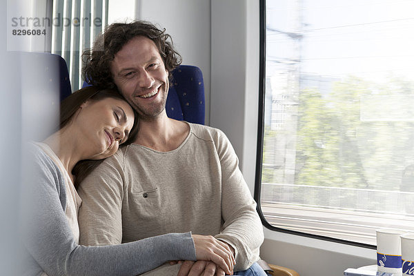 Relaxed couple in a train