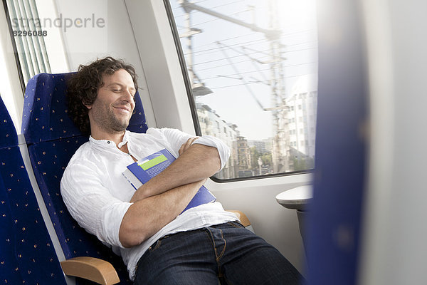 Relaxed man in a train