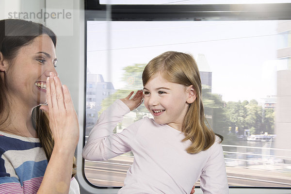 Mother and daughter in a train