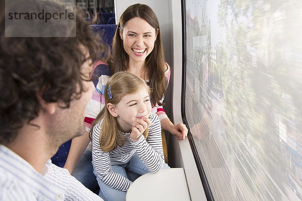 Happy family in a train