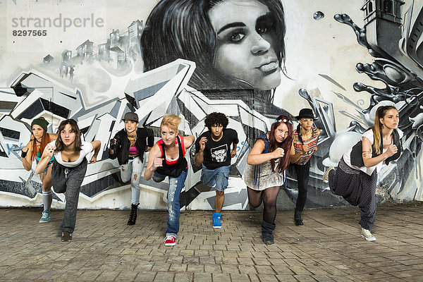 Germany  Stuttgart  Hall of Fame  Group of Hip Hop dancers at airbrush wall