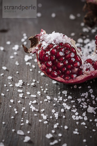 Opened pomegranate with corsican sea-salt  studio shot