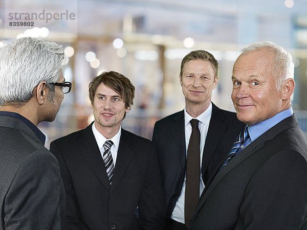 Portrait of four business men