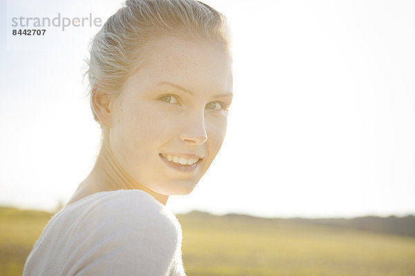 Portrait of smiling young woman  close-up