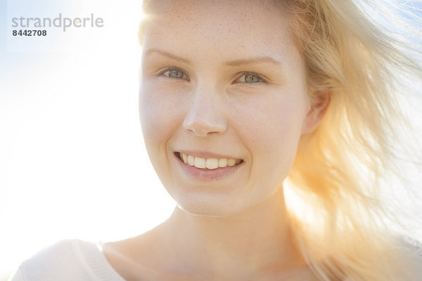 Portrait of smiling young woman  close-up