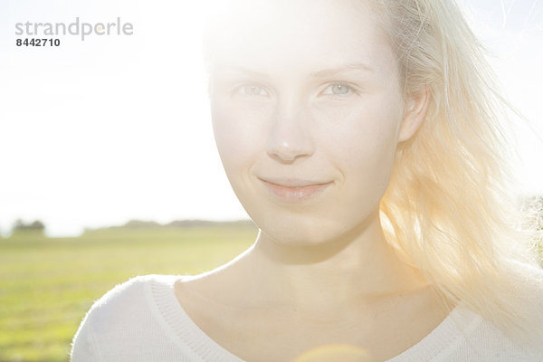 Portrait of smiling young woman  close-up