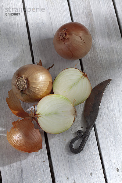 Onions on wooden table