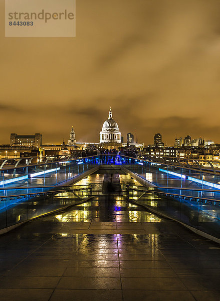 UK  London  view from Millennium Bridge to illuminated St Pauls Cathedral