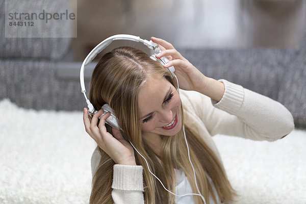 Portrait of smiling young woman with headphones