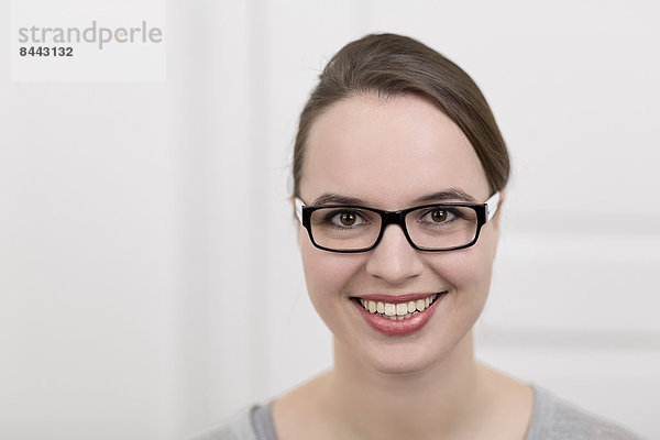 Smiling young woman with glasses  portrait