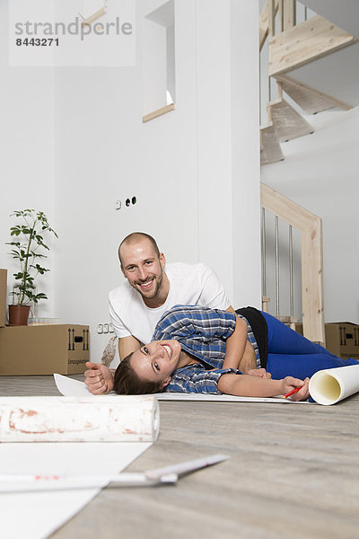 Young couple moving into new home  taking a break