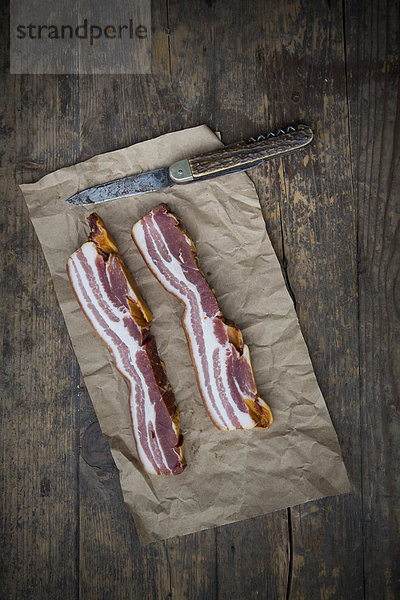 Slices of streaky bacon