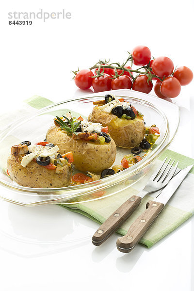 Mediterranean baked potatoes with tomatoes  spring onions  olives  chicken  ricotta and parmesan cheese