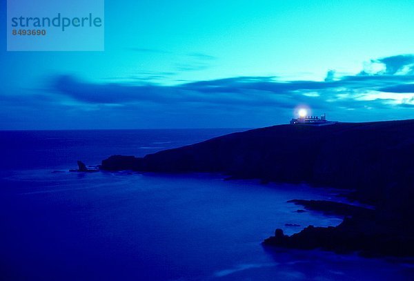 Lizard Point Lighthouse in Cornwall  England at dusk.