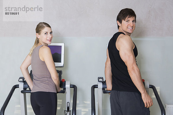 Austria  Klagenfurt  Couple training on treadmill