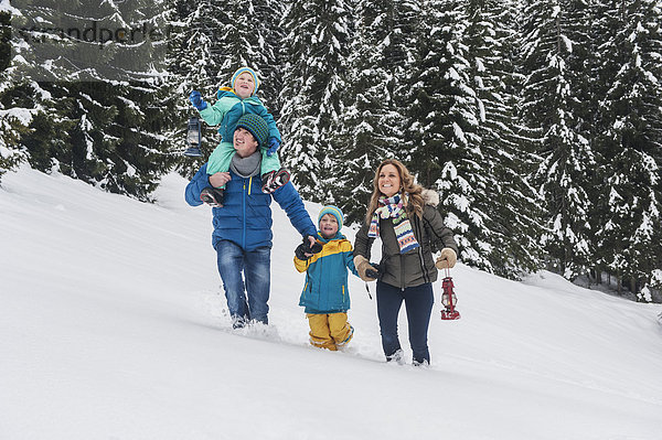 Austria  Salzburg Country  Altenmarkt-Zauchensee  Family walking in snow