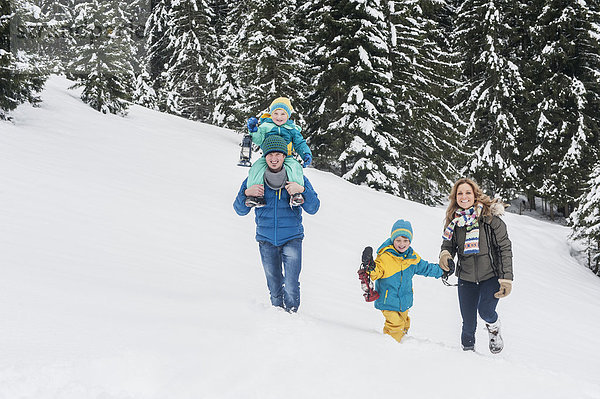 Austria  Salzburg Country  Altenmarkt-Zauchensee  Family walking in snow