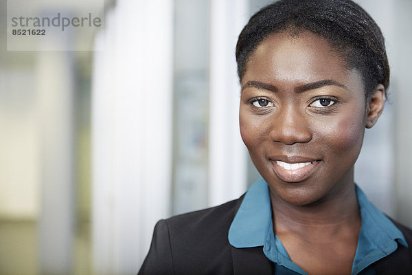 Portrait of young Afro-european business woman